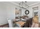 Dining room showcasing a dining table set for a meal and neutral décor at 13251 Chopin Ridge Rd, Huntersville, NC 28078