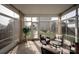 Light-filled sunroom with comfortable seating, offering a peaceful retreat overlooking the backyard at 13818 Jacks Ln, Pineville, NC 28134