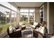 Cozy sunroom filled with natural light and comfortable furniture for relaxation at 13818 Jacks Ln, Pineville, NC 28134