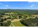 Aerial view shows boundary lines of lush, green landscape and surrounding areas, highlighting the property's location at 140 Ribbon Cir, Lincolnton, NC 28092