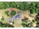 Aerial view of home with fenced in yard, mature trees, long driveway, and additional outbuildings at 140 Ribbon Cir, Lincolnton, NC 28092