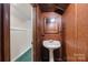 Compact bathroom featuring a sink and textured walls at 140 Ribbon Cir, Lincolnton, NC 28092