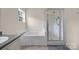 Bright bathroom featuring a tub, enclosed shower, and a window providing natural light at 140 Ribbon Cir, Lincolnton, NC 28092