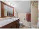 Bathroom featuring a vanity, a mirror, and a toilet at 140 Ribbon Cir, Lincolnton, NC 28092