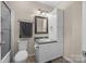 Bathroom featuring a sink, toilet, and shower with glass door at 140 Ribbon Cir, Lincolnton, NC 28092