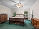 Bedroom featuring carpet, ceiling fan, and natural light from large windows at 140 Ribbon Cir, Lincolnton, NC 28092