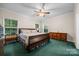 Spacious bedroom with ceiling fan, natural light and wooden furniture at 140 Ribbon Cir, Lincolnton, NC 28092
