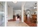 Inviting foyer with wood flooring, tile entry, and arched doorways into living spaces at 140 Ribbon Cir, Lincolnton, NC 28092