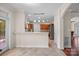 Open-concept kitchen with view of eat-in space with access to deck at 140 Ribbon Cir, Lincolnton, NC 28092
