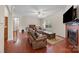 Comfortable living room with wood floors, fireplace, and large windows at 140 Ribbon Cir, Lincolnton, NC 28092