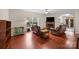 Comfortable living room with wood floors, fireplace, and large windows for ample light at 140 Ribbon Cir, Lincolnton, NC 28092