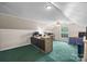 Office featuring wood desks, shelving, green carpet and a window view at 140 Ribbon Cir, Lincolnton, NC 28092