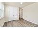 Inviting bedroom with spacious closet, ceiling fan, and neutral walls with hardwood floors at 16019 Kelby Cv, Charlotte, NC 28278