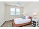 Bright bedroom features a ceiling fan, a bed, and nightstands with lamps, creating a comfy atmosphere at 16019 Kelby Cv, Charlotte, NC 28278