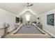 Spacious game room featuring a pool table, seating area, and modern decor at 16019 Kelby Cv, Charlotte, NC 28278