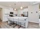 Modern kitchen features quartz countertops, stainless steel appliances, and a large island at 16019 Kelby Cv, Charlotte, NC 28278