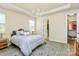 Well-decorated main bedroom featuring tray ceilings, hardwood floors, and plenty of natural light at 16019 Kelby Cv, Charlotte, NC 28278