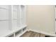 Convenient mud room featuring built-in cubbies and bench seating for organized storage at 16019 Kelby Cv, Charlotte, NC 28278
