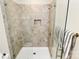 Modern tiled shower with glass doors, offering a luxurious and stylish bathing experience at 16019 Kelby Cv, Charlotte, NC 28278