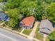 An aerial view showcasing this neighborhood home with lush green trees and landscaping at 1712 S Main St, Salisbury, NC 28144