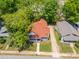 An aerial view showcasing this neighborhood home with lush green trees and landscaping at 1712 S Main St, Salisbury, NC 28144