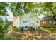 Back exterior view of home with a small deck overlooking the lawn at 1712 S Main St, Salisbury, NC 28144