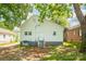 Back exterior view of home with a small deck overlooking the lawn at 1712 S Main St, Salisbury, NC 28144