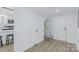 Unfinished basement area with door, water heater, and room for storage at 1712 S Main St, Salisbury, NC 28144