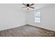 Empty bedroom with ceiling fan, window and wood-look floors at 1712 S Main St, Salisbury, NC 28144