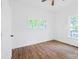Cozy bedroom features beautiful hardwood floors and natural light from multiple windows at 1712 S Main St, Salisbury, NC 28144