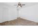 Bright bedroom featuring a ceiling fan, closet, and new wood-look floors at 1712 S Main St, Salisbury, NC 28144