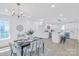 Open-concept dining area seamlessly connected to a modern kitchen, ideal for Gathering meals and gatherings at 1712 S Main St, Salisbury, NC 28144