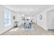 Bright and airy dining room featuring hardwood floors, a stylish table, and a seamless transition to the kitchen at 1712 S Main St, Salisbury, NC 28144