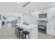 Modern kitchen featuring sleek white cabinetry, stainless steel appliances, and a stylish island with seating at 1712 S Main St, Salisbury, NC 28144