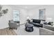Bright living room featuring modern decor, comfortable seating, and abundant natural light streaming through the windows at 1712 S Main St, Salisbury, NC 28144