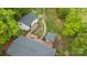 Aerial view of home featuring a sprawling deck, gazebo, well-manicured yard, and a fire pit at 17403 Green Hill Rd, Charlotte, NC 28278