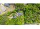 An aerial view of the home surrounded by trees, complemented by its back deck and other outbuildings on the property at 17403 Green Hill Rd, Charlotte, NC 28278