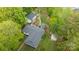 An aerial view of the home showcasing a lush green lawn, a cozy deck with a gazebo, and a separate garage at 17403 Green Hill Rd, Charlotte, NC 28278