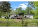 Private backyard with a deck, shed, and mature trees at 17403 Green Hill Rd, Charlotte, NC 28278