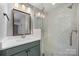 Bathroom featuring modern vanity, framed mirror, and frameless shower at 17403 Green Hill Rd, Charlotte, NC 28278