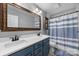 Bathroom featuring double vanity, framed mirror, and shower tub at 17403 Green Hill Rd, Charlotte, NC 28278