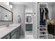 Bathroom featuring double vanity, large mirror, and walk-in closet at 17403 Green Hill Rd, Charlotte, NC 28278