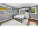 Bright bedroom showcasing a built-in murphy bed and hardwood flooring at 17403 Green Hill Rd, Charlotte, NC 28278