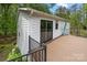 Exterior view of home highlighting the large deck and black metal railings at 17403 Green Hill Rd, Charlotte, NC 28278