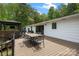 Spacious outdoor deck with dining table and chairs provides ample seating with outdoor relaxation at 17403 Green Hill Rd, Charlotte, NC 28278