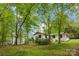 Exterior of a well-maintained home with white siding, black trim, a front yard, and inviting curb appeal at 17403 Green Hill Rd, Charlotte, NC 28278