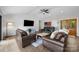 Bright living room with vaulted ceilings, hardwood floors, and a decorative wall at 17403 Green Hill Rd, Charlotte, NC 28278