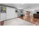Spacious living room featuring a built-in murphy bed and hardwood floors at 17403 Green Hill Rd, Charlotte, NC 28278