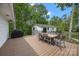 Outdoor dining set on spacious deck, perfect for entertaining with built in grill at 17403 Green Hill Rd, Charlotte, NC 28278