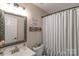 Cozy bathroom features a framed mirror, and tiled shower at 1800 Oriole Ct, Monroe, NC 28112